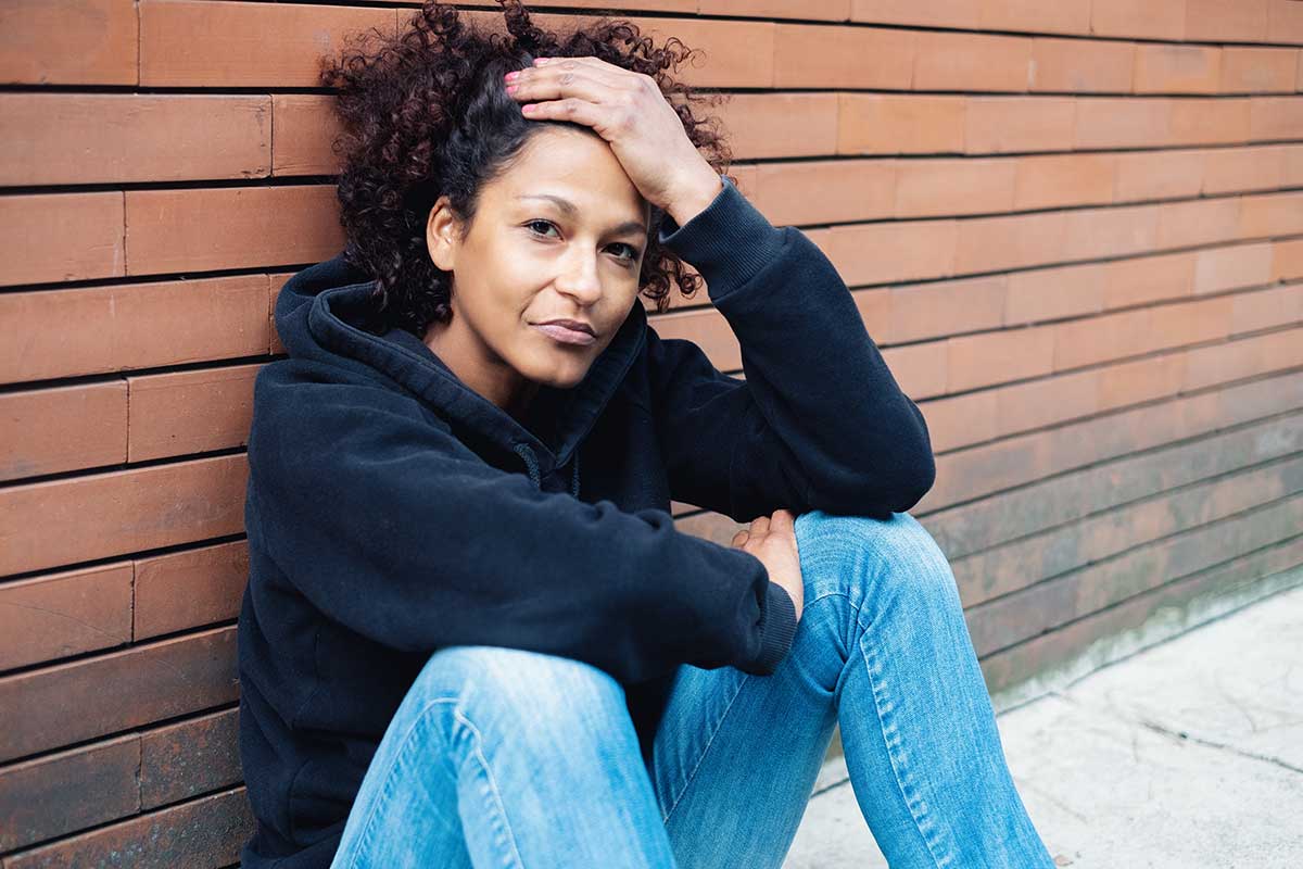 woman thinking about symptoms of opiate withdrawal