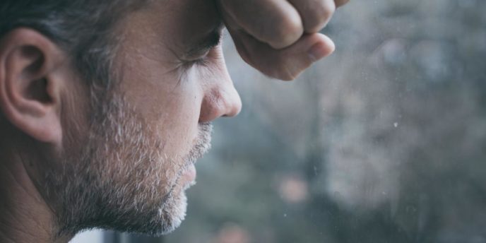 a man struggles with the physical signs of meth addiction