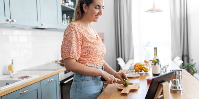 woman prepares mocktails for sober holidays