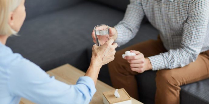 man meets with counselor for help quitting alcohol